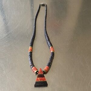 vintage Santo Domingo Kewa tribe necklace features orange coral and black